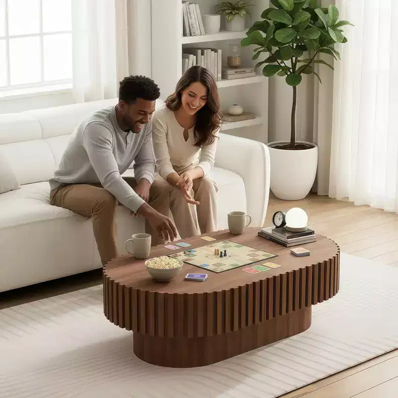 Table basse ovale marron, base piédestal cannelée, utilisation individuelle
